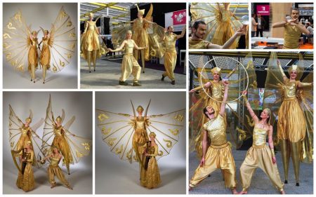 Schoonheid in Goud Parade: Unieke samenstelling van steltenlopers, danseressen en live muziek voor betoverende straatparades en evenementen!