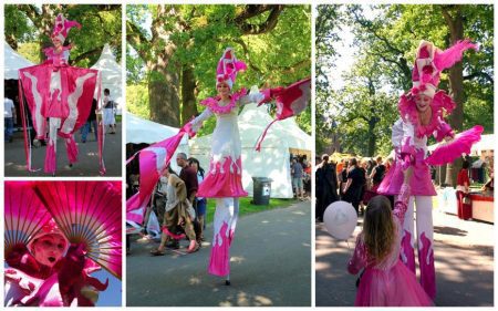 Laat de Prinses in Roze Wit Steltenloper de magie van je evenement verhogen en glimlachen verspreiden waar ze gaat!