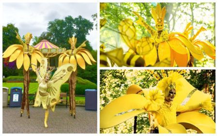 Laat de Gouden Bloemen Steltenlopers de zomerse magie naar uw evenement brengen!