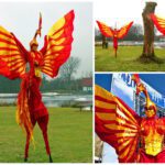 Betoverende Rood Gele Vuur Vogels Steltenlopers: Laat uw evenement ontvlammen met een vurig spektakel van kleur en charisma. Boek nu!