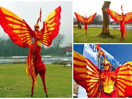 Betoverende Rood Gele Vuur Vogels Steltenlopers: Laat uw evenement ontvlammen met een vurig spektakel van kleur en charisma. Boek nu!